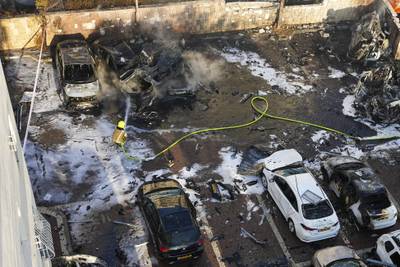 Israeli firefighters extinguish fire after a rocket attack on Ashkelon. AP Photo