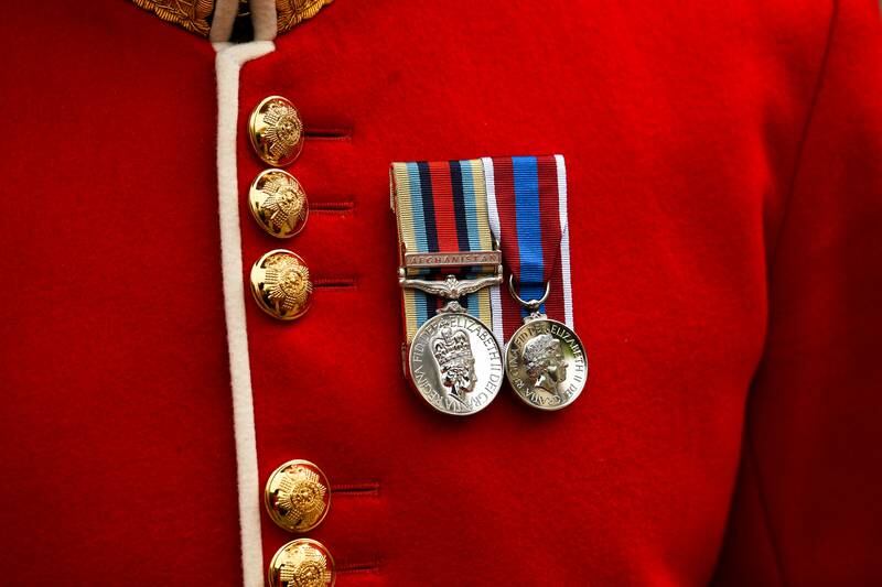 A member of the Household Division wears medals bearing the face of Britain's Queen Elizabeth, outside St Paul's Cathedral. Reuters