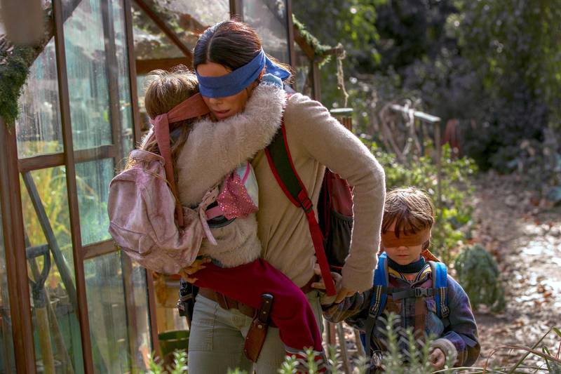 This image released by Netflix shows Sandra Bullock in a scene from the film, "Bird Box." Netflix will remove footage of a real fiery train disaster from its hit post-apocalyptic survival film "Bird Box" months after the streaming giant was criticized for exploiting a tragedy. The stock footage was taken from a 2013 crash in the Quebec town of Lac-Megantic when a train carrying crude oil came off the tracks and exploded into a massive ball of fire, killing 47 people. (Saeed Adyani/Netflix via AP)
