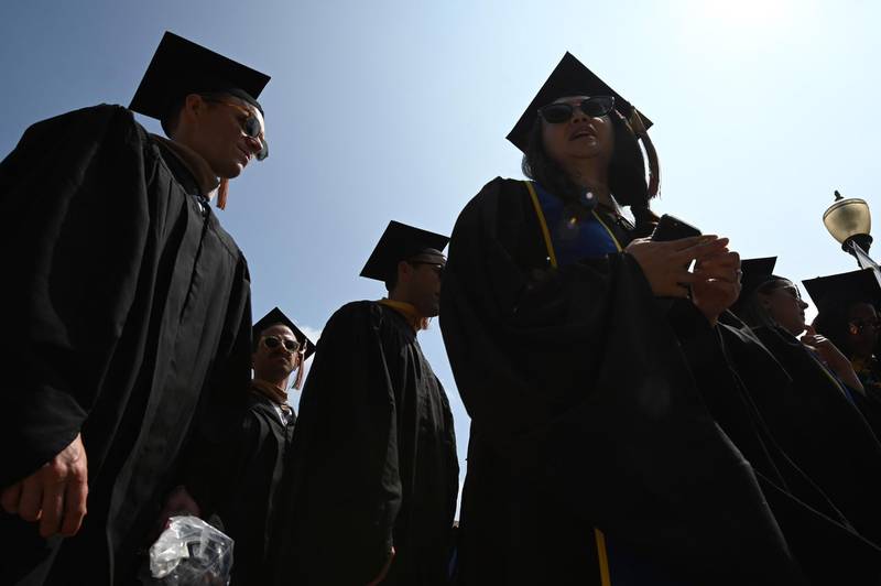 Students wearing academic regalia attend their graduation ceremony at the University of California Los Angeles (UCLA), June 14, 2019 in Los Angeles California. With 45 million borrowers owing $1.5 trillion, the student debt crisis in the United States has exploded in recent years and has become a key electoral issue in the run-up to the 2020 presidential elections.
"Somebody who graduates from a public university this year is expected to have over $35,000 in student loan debt on average," said Cody Hounanian, program director of Student Debt Crisis, a California NGO that assists students and is fighting for reforms.
 / AFP / Robyn Beck
