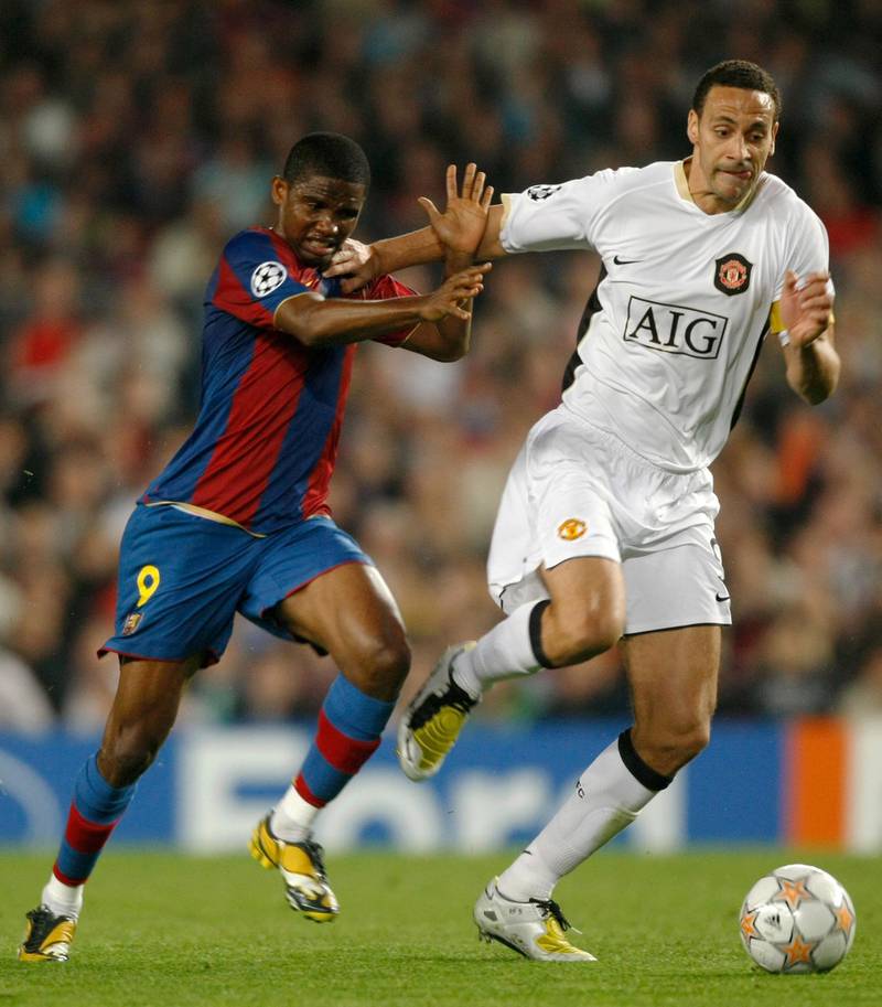 FILE PHOTO: Barcelona's Samuel Eto'o (L) challenges Manchester United's Rio Ferdinand for the ball during their Champions League semi-final first leg soccer match at the Camp Nou stadium in Barcelona, April 23, 2008.     REUTERS/Albert Gea/File Photo