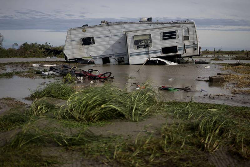 A damaged travel trailer sits among flood water after Hurricane Laura passed through the area in Holly Beach, Louisiana. AFP