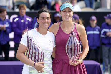 CHARLESTON, SOUTH CAROLINA - APRIL 09: Ons Jabeur of Tunisia and Belinda Bencic of Switzerland pose with their trophies3 during the Finals of the Credit One Charleston Open at Credit One Stadium on April 09, 2023 in Charleston, South Carolina.    Matthew Stockman / Getty Images / AFP (Photo by MATTHEW STOCKMAN  /  GETTY IMAGES NORTH AMERICA  /  Getty Images via AFP)