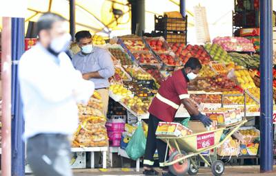 DUBAI, UNITED ARAB EMIRATES , June 9 – 2020 :- People wearing protective face mask and buying fruits and vegetables at the Al Awir fruit & vegetable market during the hot and humid weather in Dubai. (Pawan Singh / The National) For News/Standalone/Online/Stock