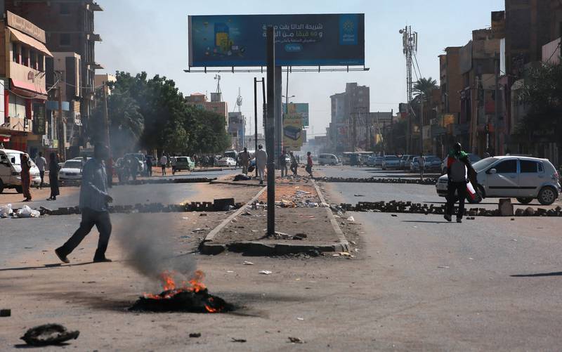 Protesters block a street during a rally in Khartoum this week to protest the deal in which Prime Minister Abdalla Hamdok was reinstated after his removal in October. AFP