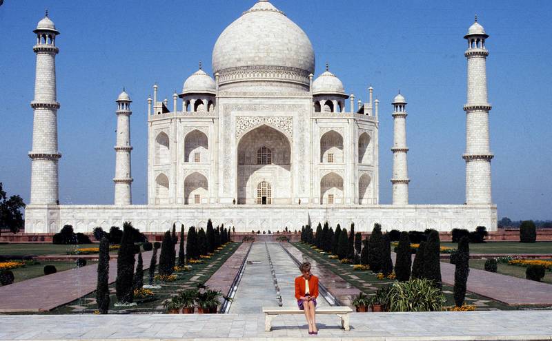 AGRA, INDIA - FEBRUARY 11:   Diana, Princess of Wales poses alone at the Taj Mahal during her visit in India on February 11, 1992. 12 years earlier her husband, the Prince of Wales, posed in the same spot.  (Photo by Anwar Hussein/Getty Images)