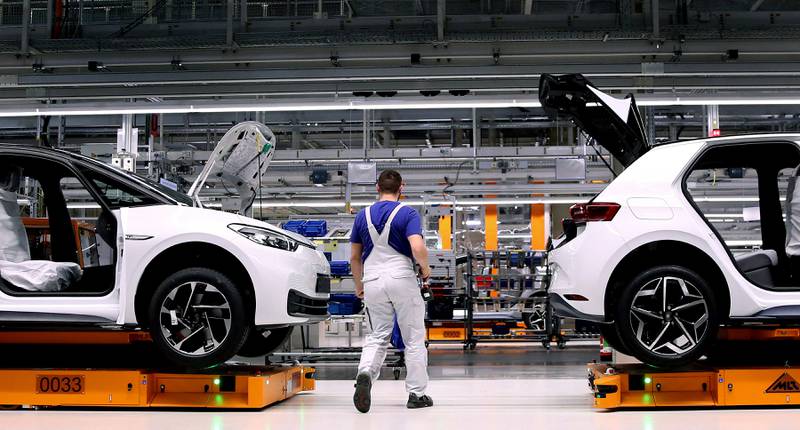 A Volkswagen factory employee works on an electric car assembly line in Germany, which plans to overhaul its flagship industry. AFP