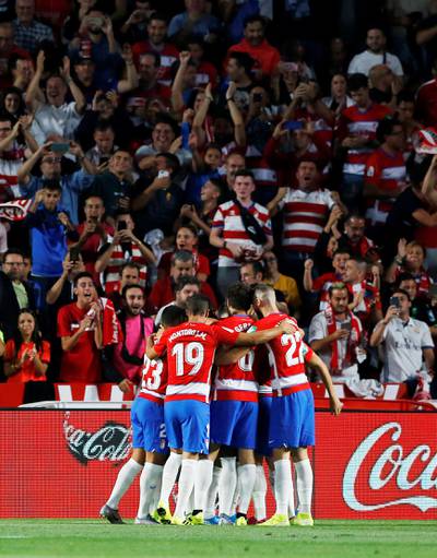 Granada's Ramon Azeez celebrates scoring their first goal with teammates. Reuters