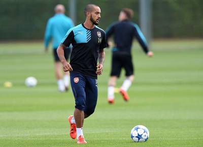 Arsenal's Theo Walcott shown in action during a training session on Monday ahead of their Champions League match against Olympiakos on Tuesday. Andy Rain / EPA