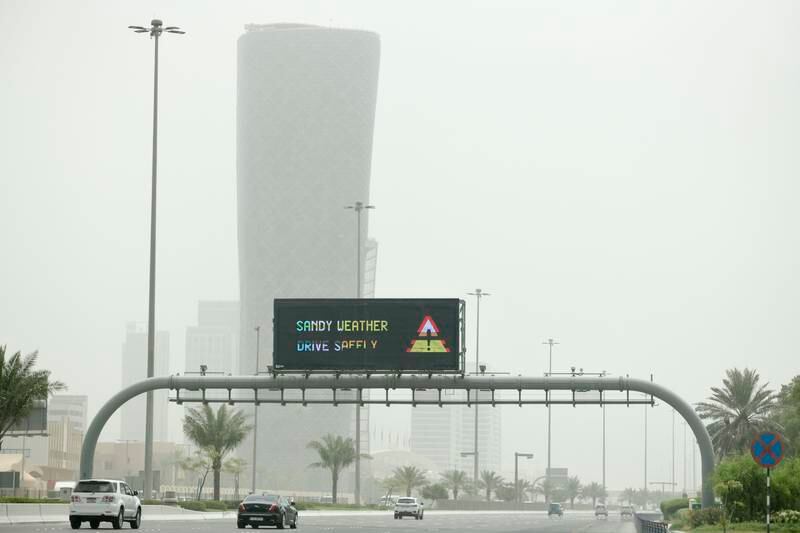 A road sign cautions over sandy weather in Abu Dhabi. Khushnum Bhandari / The National