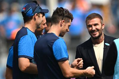 David Beckham interacts with New Zealand's players in Mumbai on Wednesday. AFP