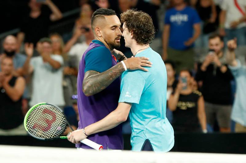 Nick Kyrgios and Ugo Humbert embrace after their second round match at the Australian Open. Getty Images