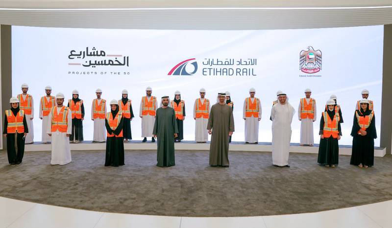 The leaders pose with officials of the Etihad Rail project, which has taken thousands of heavy vehicles off the UAE's roads.