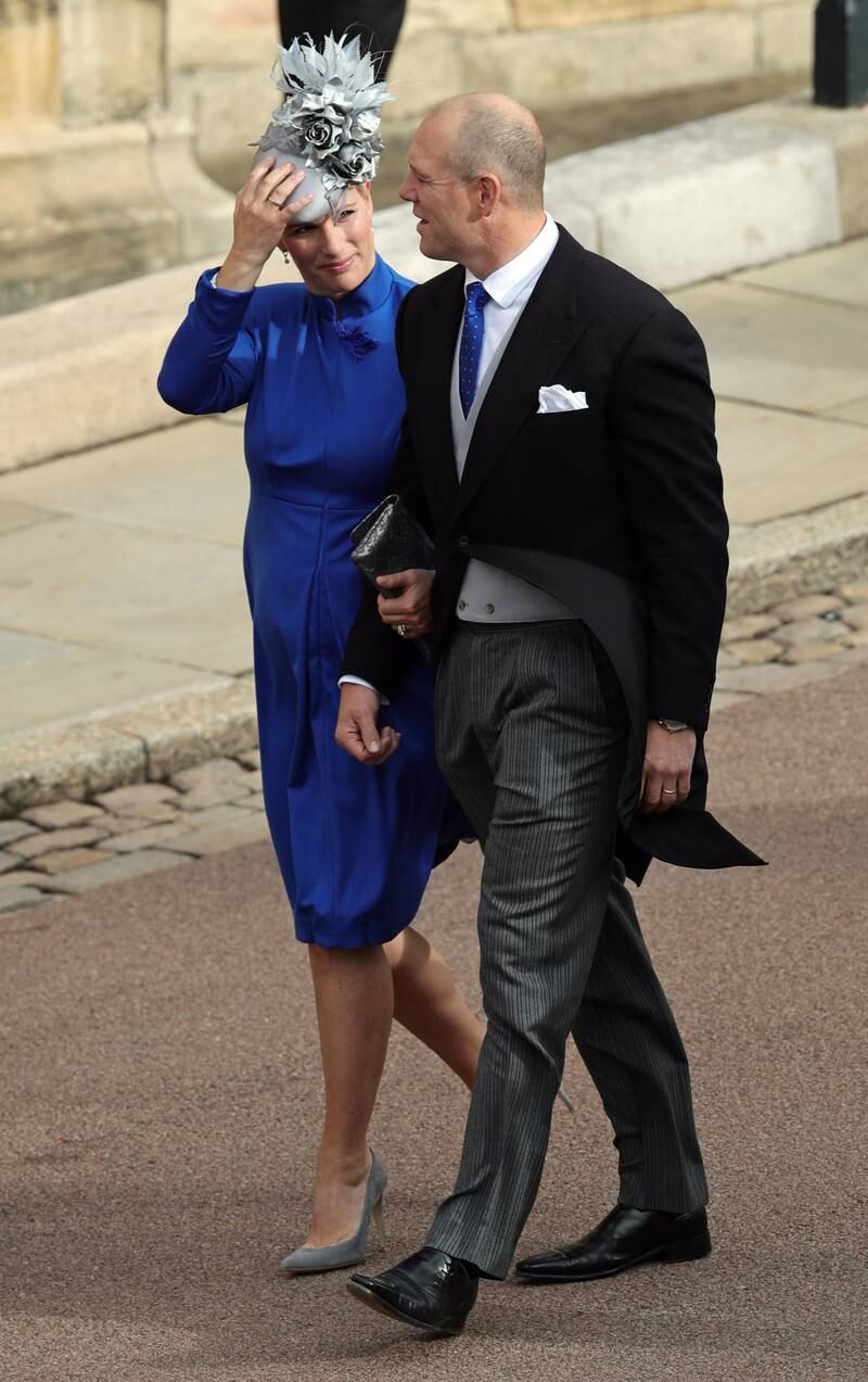 Zara Tindall, wearing a royal blue dress and a light blue headpiece, and Mike Tindall arrive ahead of the wedding of Princess Eugenie of York and Jack Brooksbank at St George's Chapel, Windsor on October 12, 2018. Getty Images