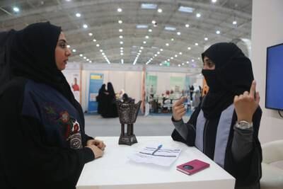 RIYADH, SAUDI ARABIA - DECEMBER 8: A Saudi woman gets assistance to be directed to the suitable jobs for her during the first annual Bab Rizq Jameel, a three-day job opportunity fair for Saudi youth, where candidates are interviewed by companies and can be instantly hired, at the Riyadh Convention Center on December 8, 2015 in Riyadh , Saudi Arabia. Bab Rizq Jameel is a growing initiative that was launched with just two jobs in 2003 by a Saudi businessman to create jobs for Saudi men and women by linking them with with the companies that are looking for their skills. BRJ has helped 280.000 Saudi men and women to find training and work in Saudi Arabia. (Photo by Jordan Pix/ Getty Images)