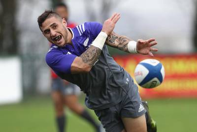TJ Perenara of the New Zealand All Blacks passes during training at the Suresnes Rugby Club in Paris, France. Phil Walter / Getty Images