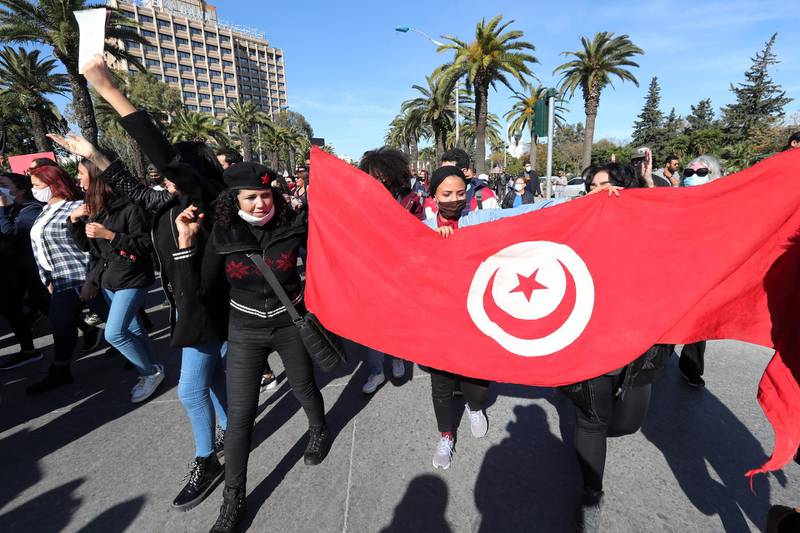 Tunisian anti-government protesters shout slogans during a demonstration in Tunis. EPA