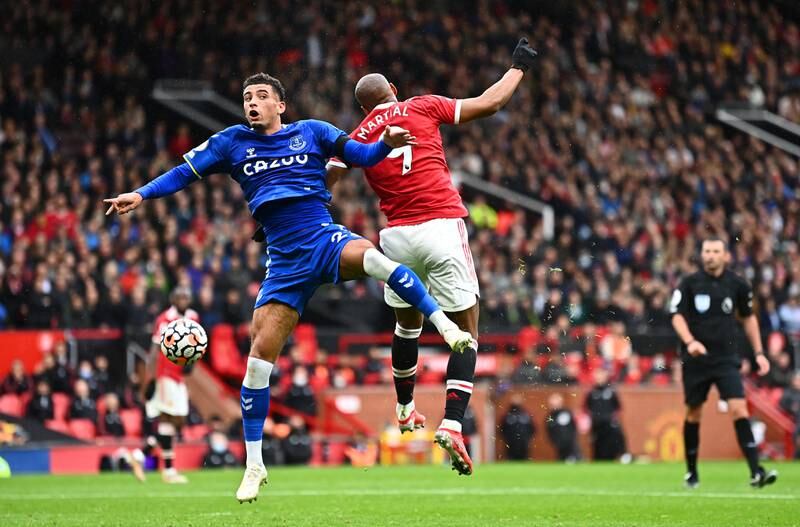 Everton defender Ben Godfrey and Anthony Martial compete for a header. Getty