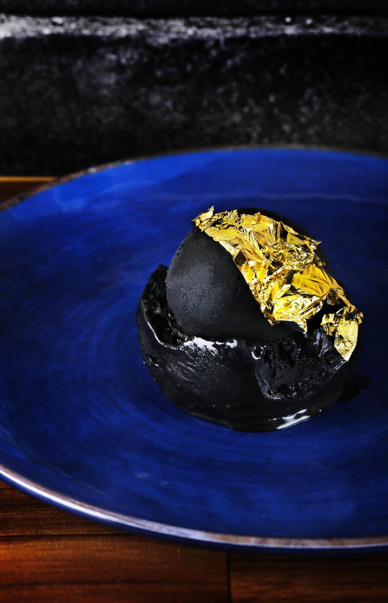 Edible charcoal ice cream with 23K gold at Scoopi, Dh99