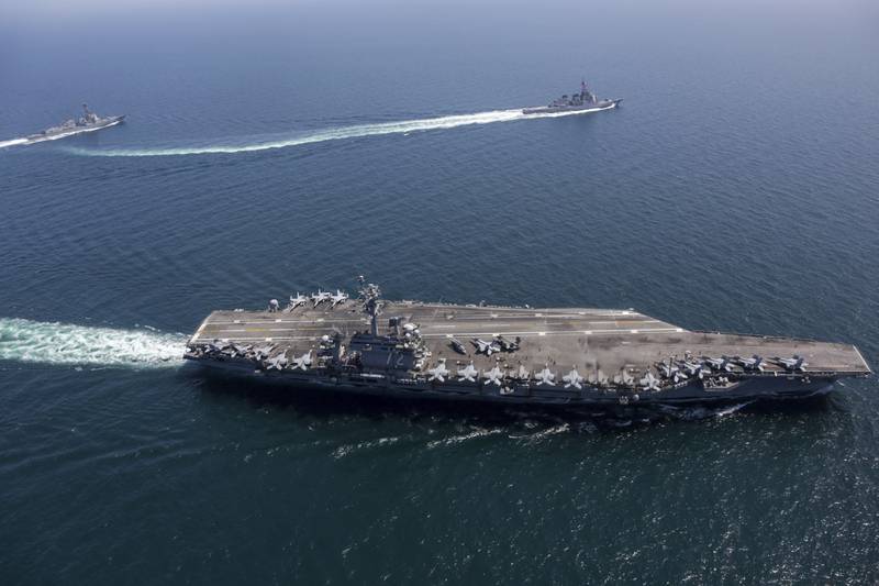 USS Abraham Lincoln, front, and other warships sail in formation during a US-Japan exercise in the Sea of Japan.  AP