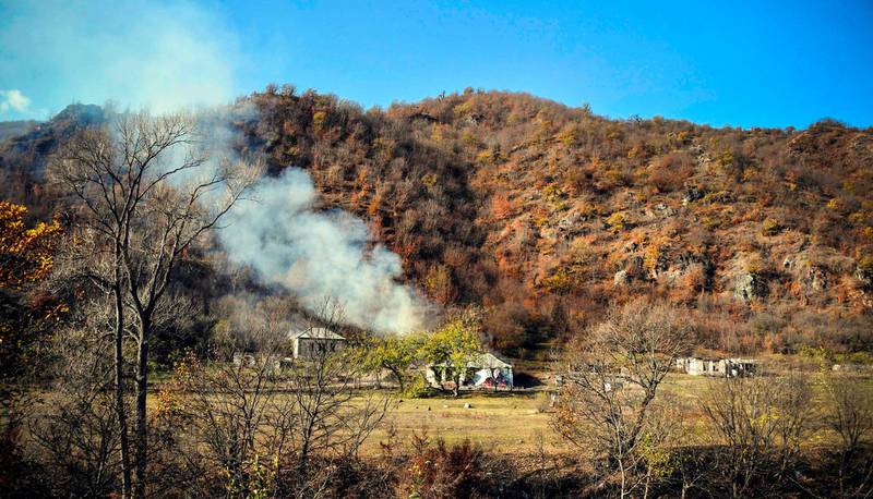 A house burns in the village of Charektar outside the town of Kalbajar  villagers in Nagorno-Karabakh set their houses on fire before fleeing to Armenia.  AFP