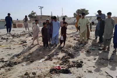 Local residents stand at the site of the explosion in Mastung, Balochistan, south-western Pakistan.  AFP