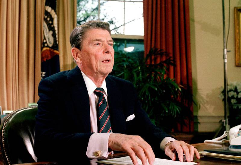 FILE - This Jan. 28, 1986, file photo shows President Ronald Reagan in the Oval Office of the White House after a televised address to the nation about the space shuttle Challenger explosion. In moments of crisis, American presidents have sought to summon words to match the moment in the hope that the power of oratory can bring order to chaos and despair. (AP Photo/Dennis Cook, File)