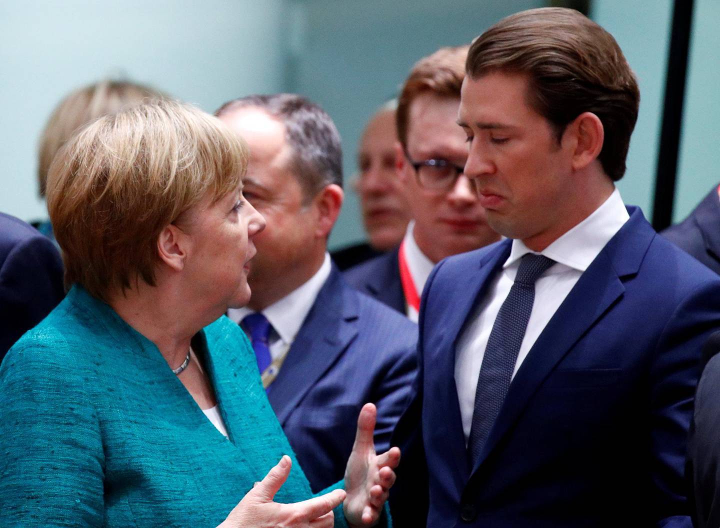 REFILE - CORRECTING ID German Chancellor Angela Merkel talks with Austrian Chancellor Sebastian Kurz as they attend an European Union leaders summit in Brussels, Belgium, June 28, 2018. REUTERS/Francois Lenoir