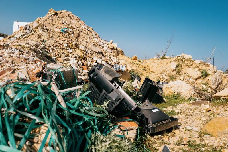Tunisia lacks the equipment to properly dispose of electronic waste. Here, a pile of old TVs are discarded along with mounds of construction rubble in the Sebkha Ariana wetland just north of Tunis.