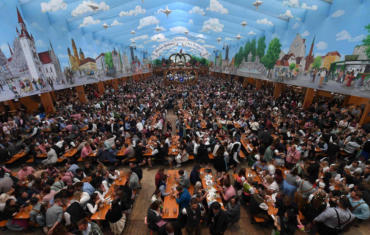 (FILES) This file photo taken on October 3, 2019 shows people crowding in a beer tent of the Oktoberfest beer festival in Munich, southern Germany.  Germany's Oktoberfest beer festival will be cancelled in the year 2020 as "risks are too high" from the novel coronavirus, Bavarian state premier Markus Soeder said Tuesday, April 21, 2020. / AFP / Christof STACHE
