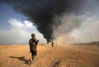 Iraqi forces advance towards the city of al-Qaim, in Iraq's western Anbar province near the Syrian border, as they fight against remnant pockets of ISIS forces, on November 3, 2017.