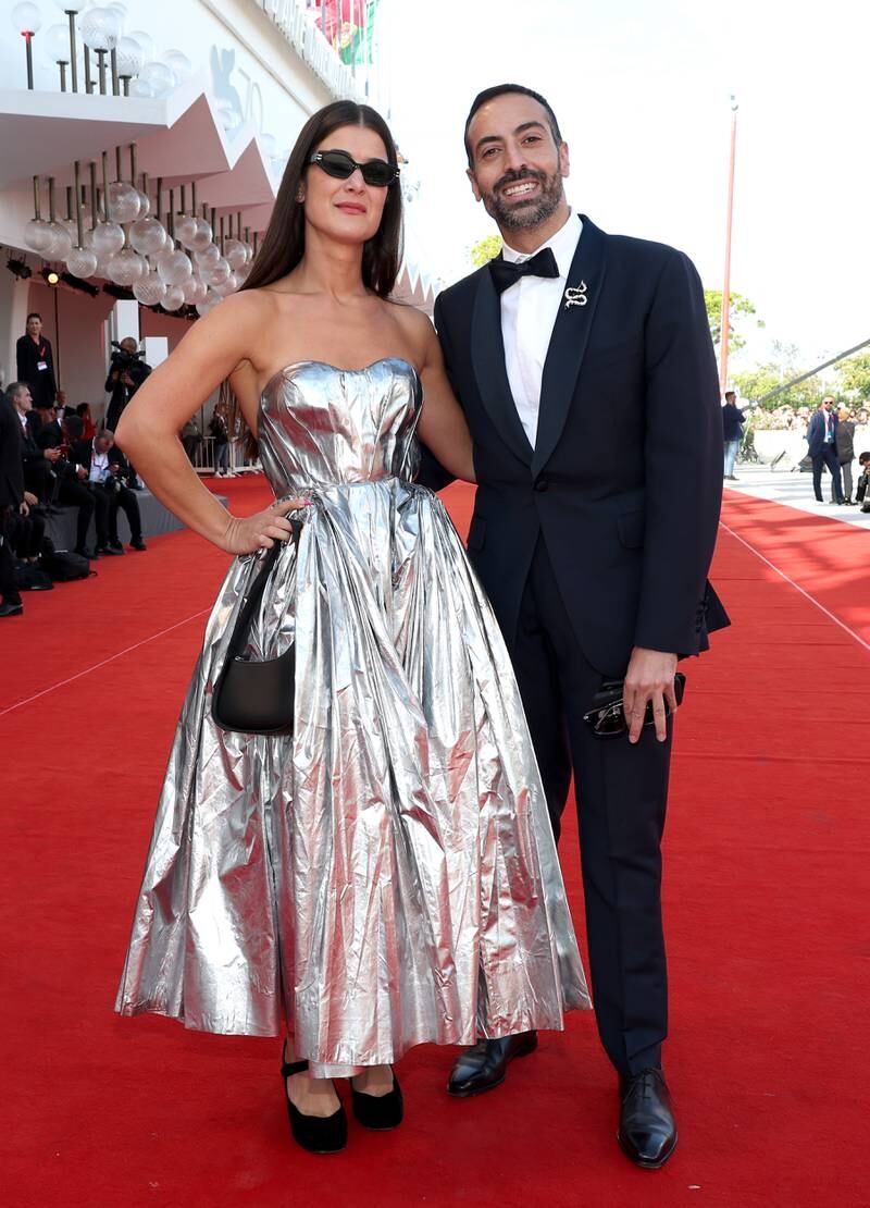 Red Sea International Film Festival chief executive Mohammed Al-Turki and a guest, dressed in Alexander McQueen, attend the 'Tar' red carpet. Getty Images 