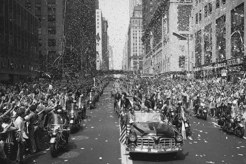 People line 42nd Street in New York to cheer Apollo 11 astronauts traveling towards the United Nations. AP Photo