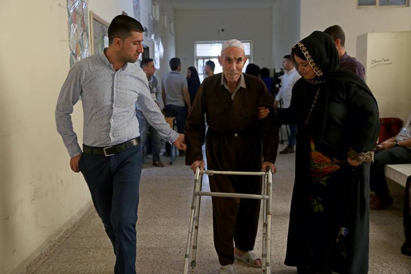 A Kurdish elderly man is assisted by others while on his way to vote during the Kurdistan parliamentary election at a polling station in Erbil, the capital of the Kurdistan Region in Iraq. With over three million people eligible to vote, the semi-autonomous region is voting on its parliamentary elections a year after a failed bid for independence from Iraq.  EPA