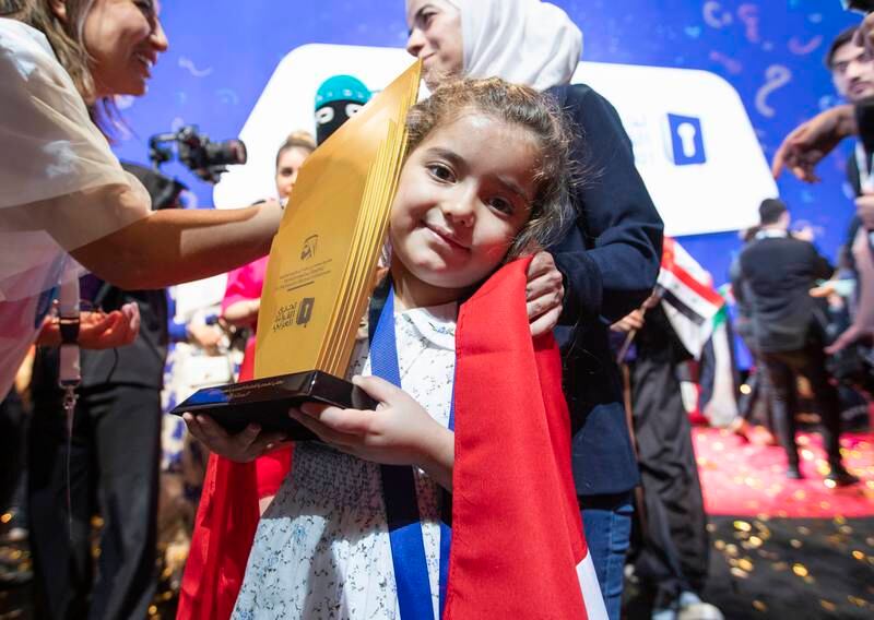 Sham Bakour of Syria with her first-place trophy at the Arabic Reading competition ceremony at Dubai Opera.  Ruel Pableo for The National