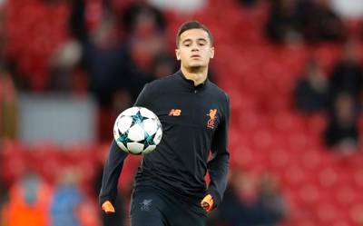 FILE - In this file photo dated Wednesday, Sept. 13, 2017, Liverpool's Philippe Coutinho during a warm up prior to the Champions League soccer match between Liverpool and Sevilla at Anfield stadium in Liverpool, England.  Coutinho arrives at Barcelona soccer club Sunday Jan. 7, 2018, signed from Liverpool for a huge price tag and expected to continue the long line of Brazilian stars who have dazzled at Camp Nou. (AP Photo/Frank Augstein, FILE)