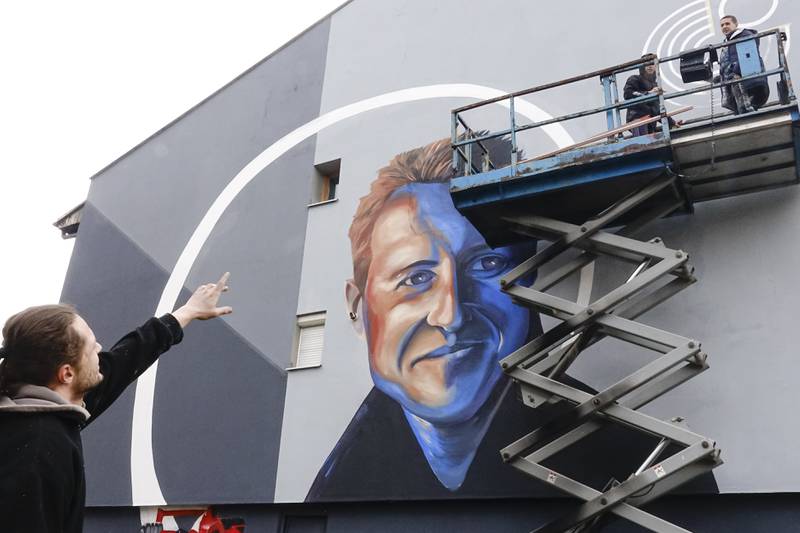 A mural of Michael Schumacher on a building which was rebuilt with the F1 star's support in Sarajevo, Bosnia. AP