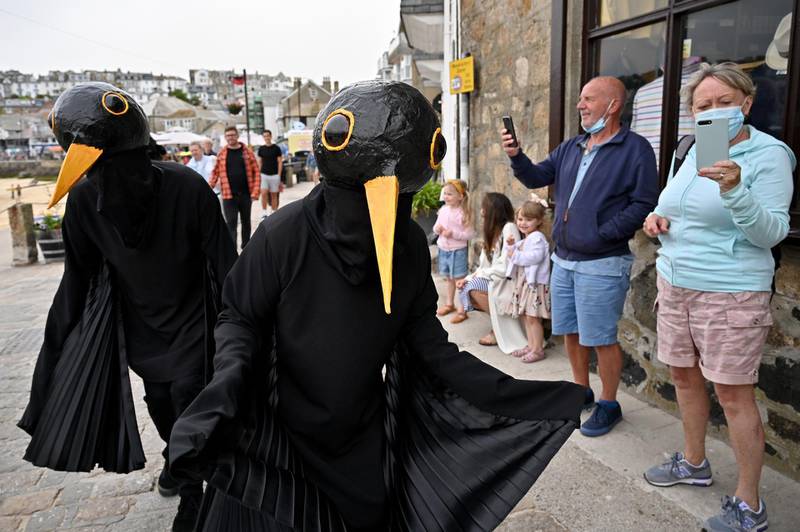 Extinction Rebellion activists stage a "Wake-up Call" theatrical action in St Ives. Getty Images