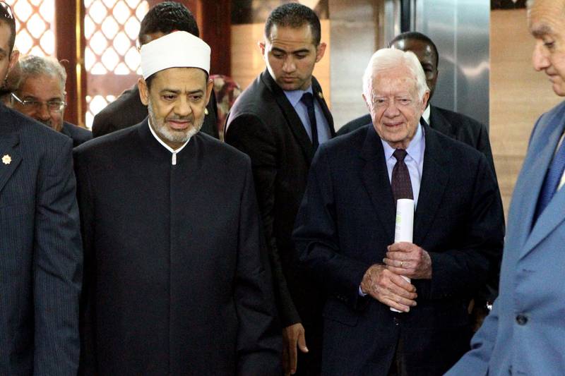 Dr Al Tayeb greets former US president Jimmy Carter upon the latter's arrival for a meeting in Cairo on May 24, 2012. AFP