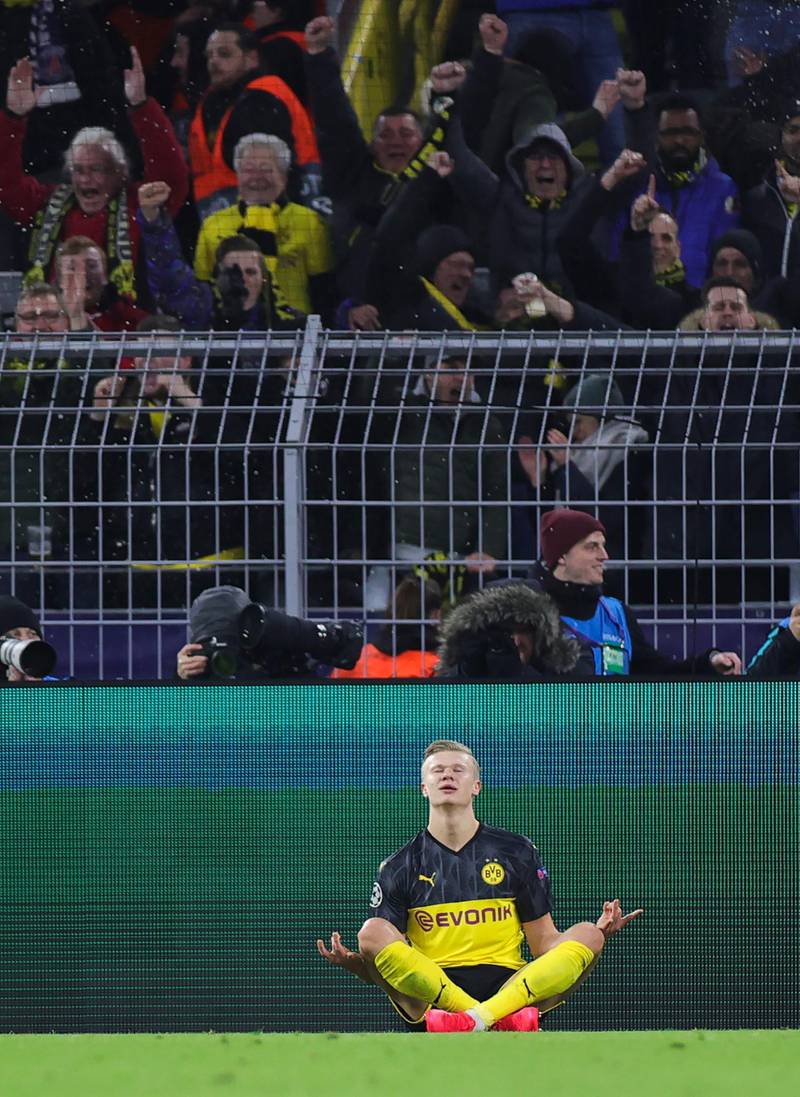 Borussia Dortmund's Erling Braut Haaland celebrates after scoring his opening goal against Paris Saint-Germain in the Champions League last-16 first-leg game in Germany on Tuesday, February 18. Dortmund won the game 2-1. EPA