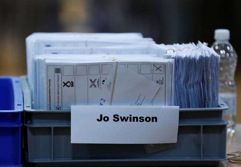 Ballots in a tray labelled Jo Swinson, Liberal Democrats candidate for East Dunbartonshire, are seen at a counting centre for Britain's general election in Bishopbriggs, Britain. Reuters