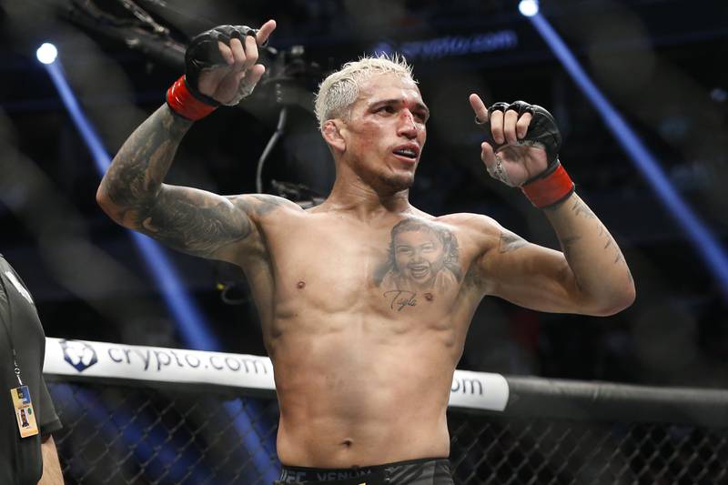 Charles Oliveira reacts after defeating Dustin Poirier by submission to defend his UFC lightweight title at UFC 269, Saturday, December 11, 2021, in Las Vegas. AP Photo