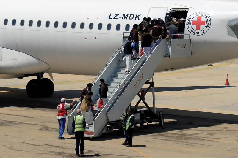 Houthi prisoners board a plane before heading to Sanaa airport as they are released by the Saudi-led coalition in a prisoner swap, at Sayoun airport, Yemen. Reuters