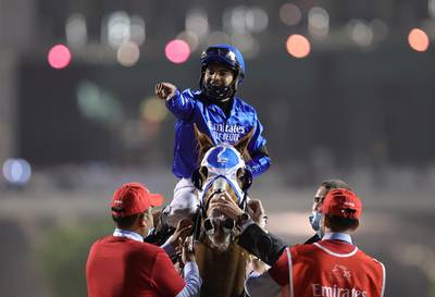 Luis Saez celebrates winning the Dubai World Cup on Mystic Guide. REUTERS