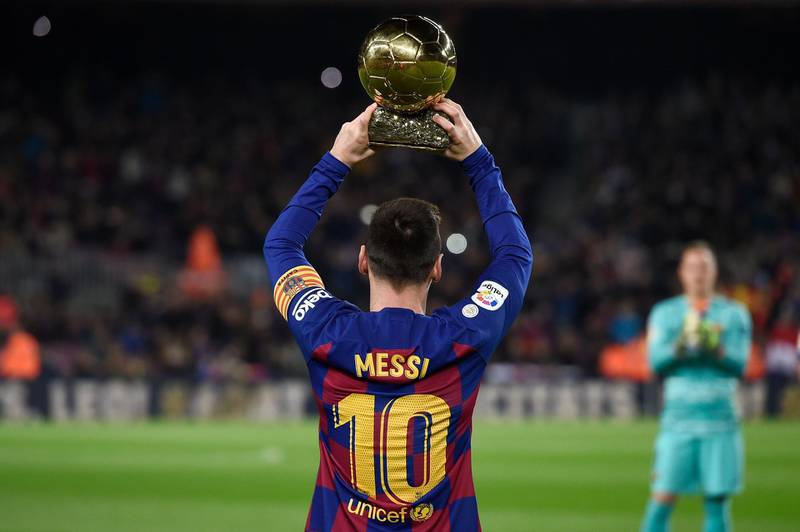 Messi poses with his sixth Ballon d'Or in December. AFP