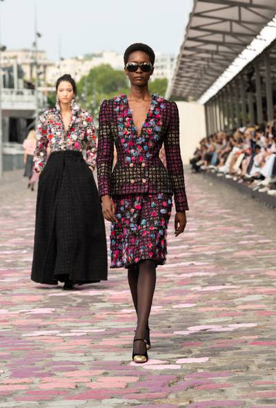 Chanel outfits on celebrities attending Chanel Haute Couture Fall