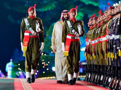 Mohammad bin Salman inspects a guard of honour in Islamabad. EPA
