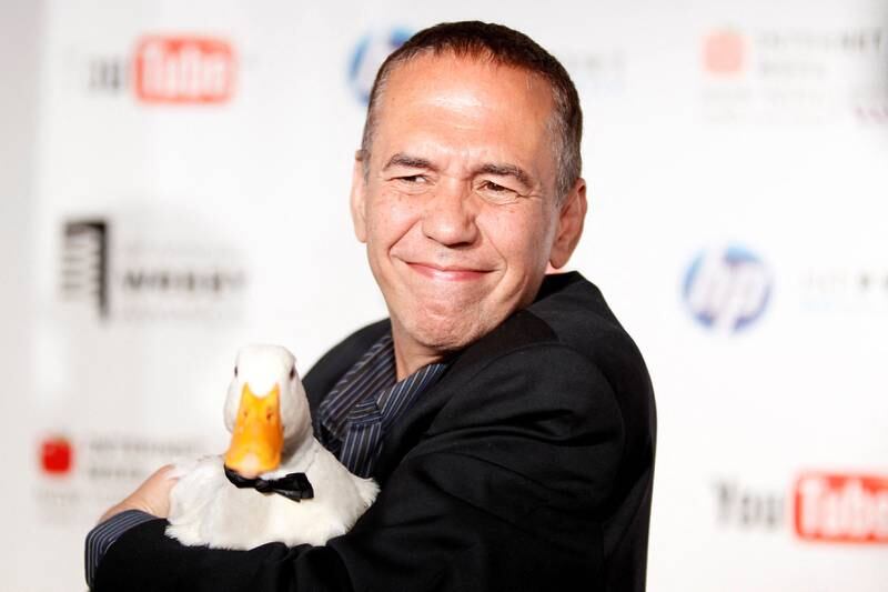 FILE PHOTO: Comedian Gilbert Gottfried arrives with a duck at the Webby Awards in New York June 14, 2010.  REUTERS / Lucas Jackson / File Photo