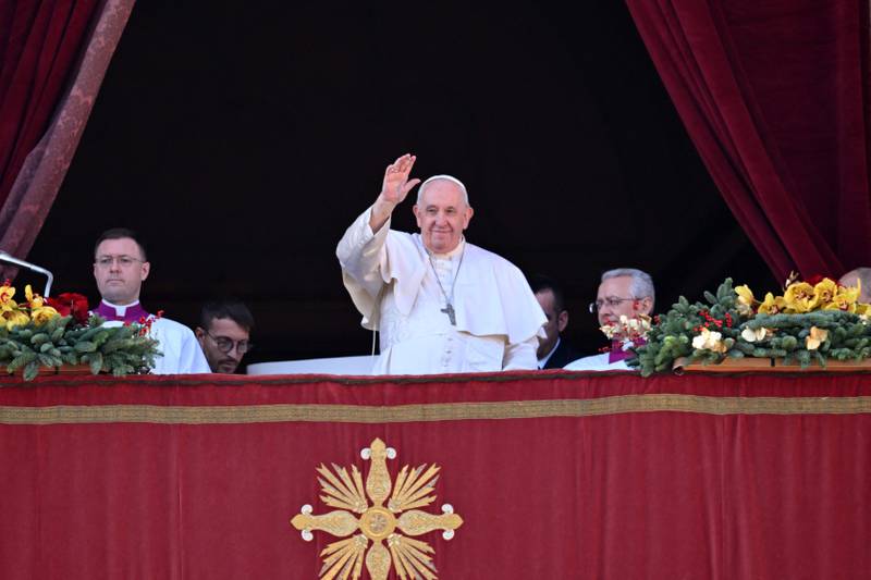 Pope Francis at the balcony to deliver his Christmas Urbi et Orbi blessing in St Peter's Square at the Vatican. AFP