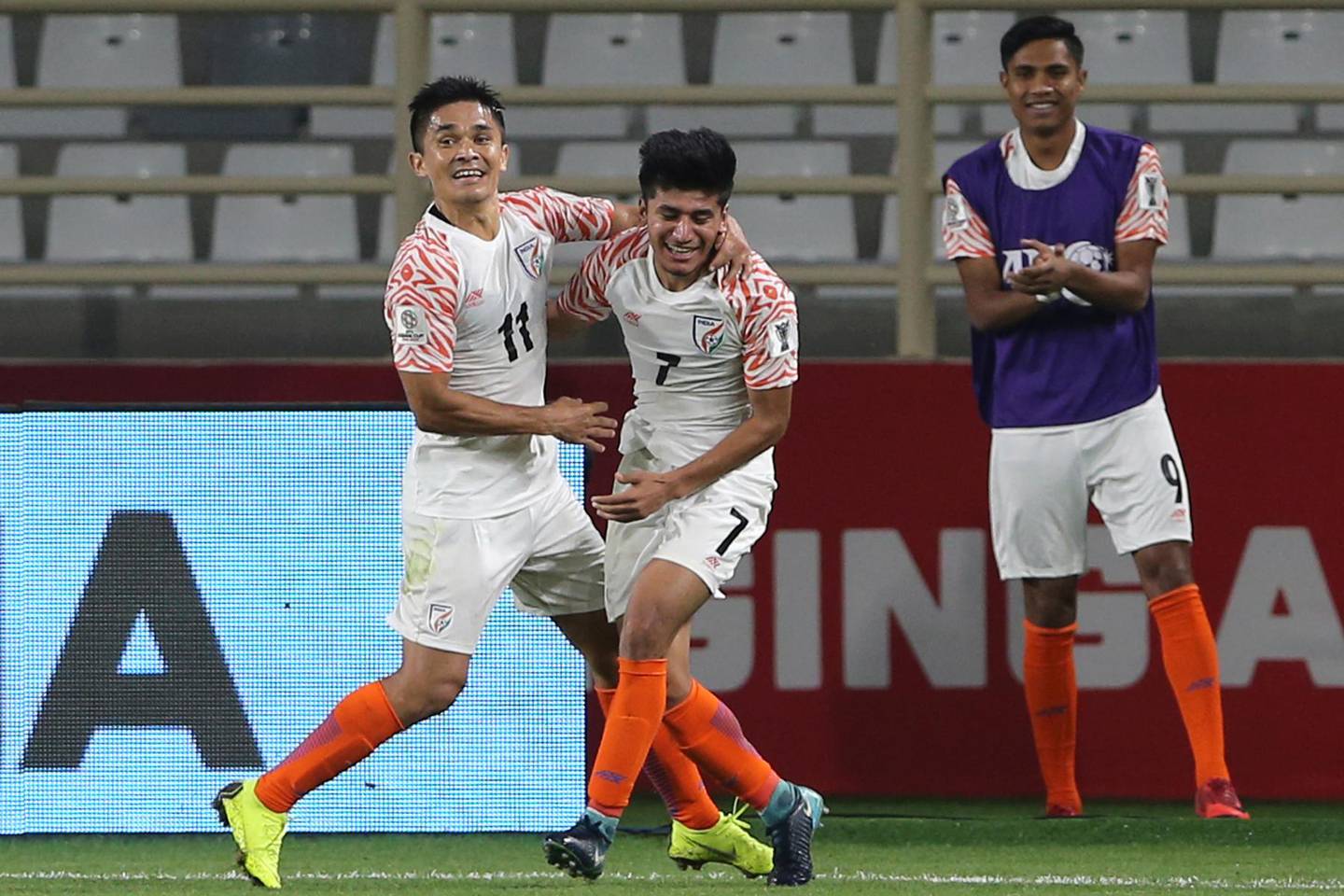 India's forward Sunil Chhetri, left, and India's midfielder Anirudh Thaparight, celebrate their third goal during the AFC Asian Cup group A soccer match between Thailand and India at Al Nahyan Stadium in Abu Dhabi, United Arab Emirates, Sunday, Jan. 6, 2019. (AP Photo/Kamran Jebreili)